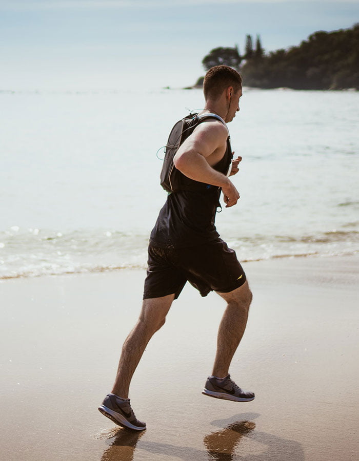 man-running-on-beach